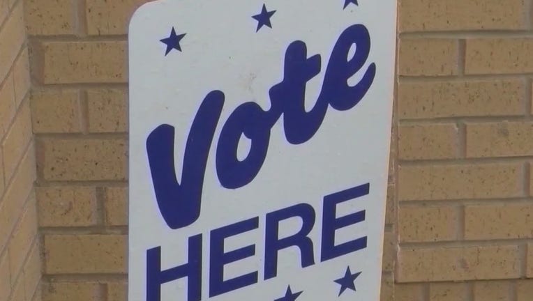 Vote here sign