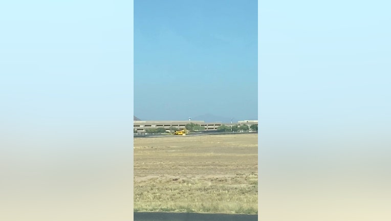Screenshot of a video showing a plane making a belly landing at Falcon Field in Mesa, Arizona on October 11, 2020