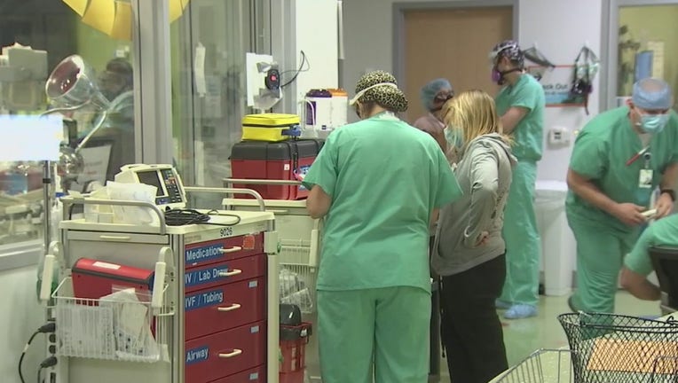 Nurses and doctors work on the COVID floor at Valleywise Hospital.