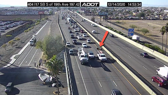 Driver, passenger OK after dump truck plunges onto 19th Avenue from I-17 in Phoenix