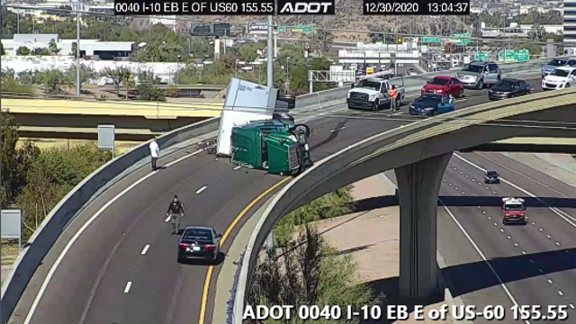 Semi truck hauling soda rolls over, crash blocks US 60, I-10 transition ramp