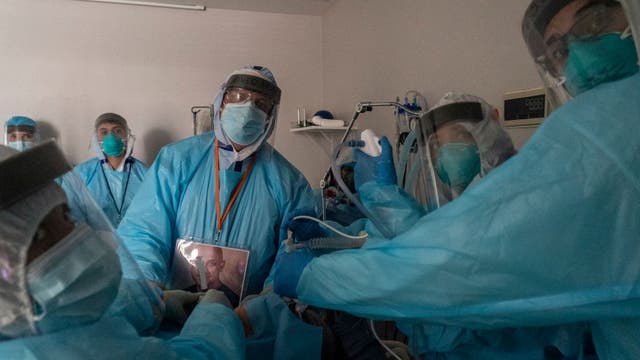 Overwhelmed hospitals scramble for help amid pandemic