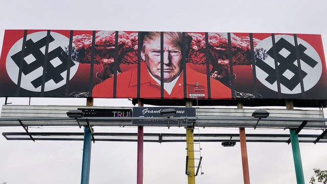 New billboard in downtown Phoenix shows Trump behind bars in prison jumpsuit