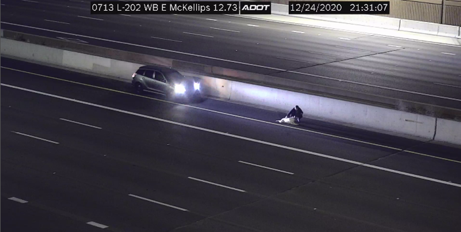 ADOT camera shows Good Samaritan helping injured dog on Loop 202