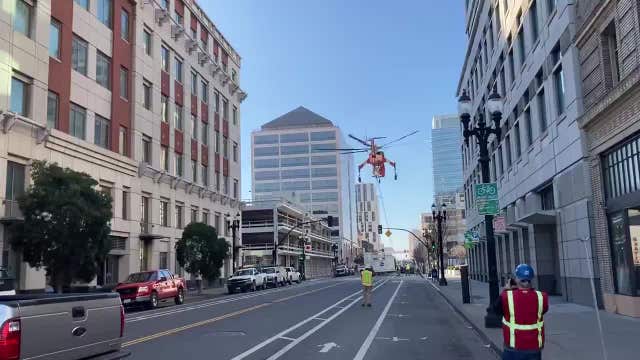 Helicopter drops huge A/C unit onto Oakland street