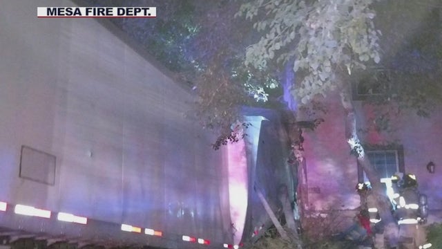 Man dead, 4 others injured after semi-truck plows through wall, into house in Mesa