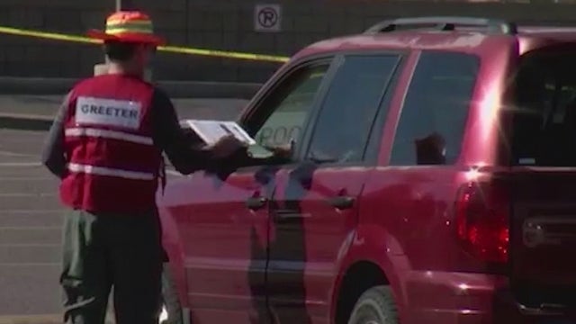 Arizona COVID-19 vaccination site volunteers receive vaccine doses