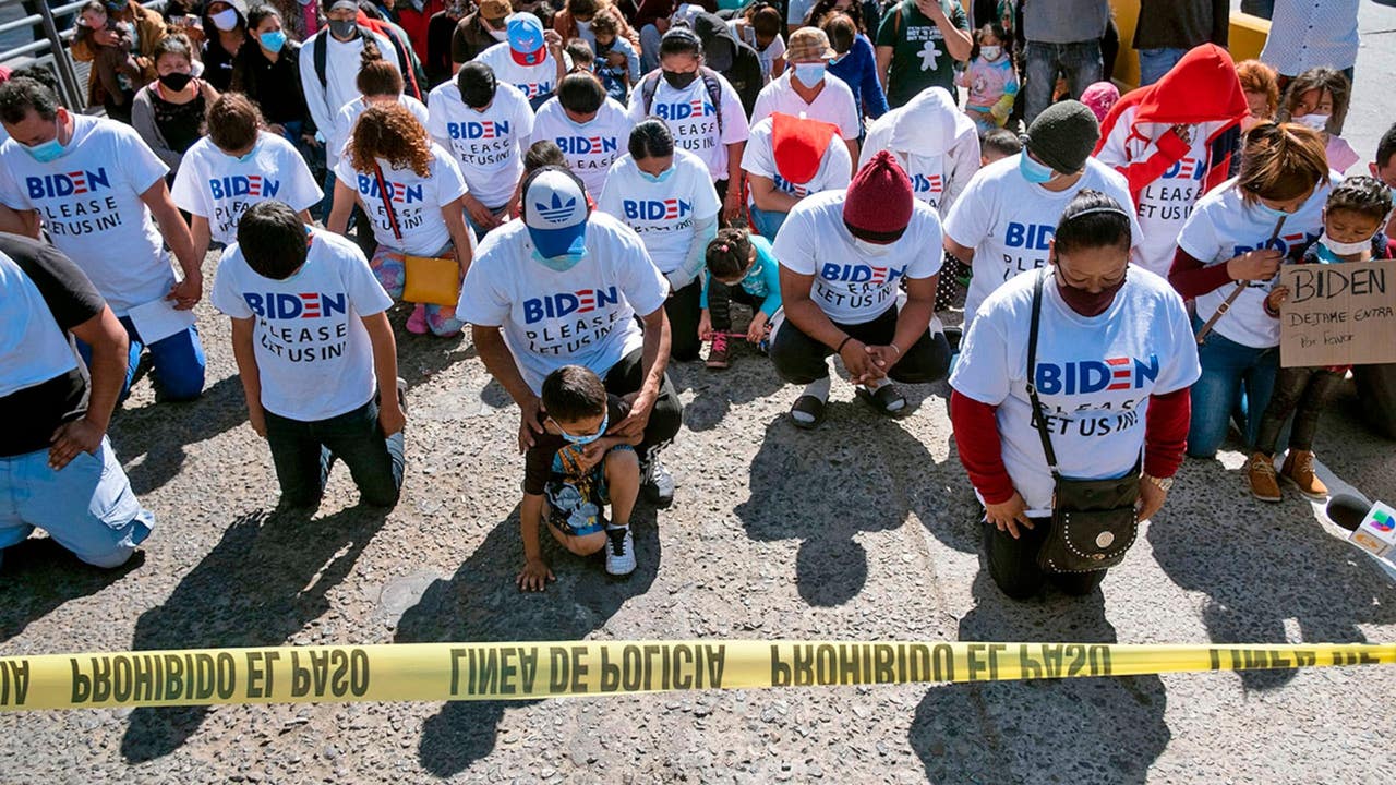 Migrants wear Biden T-shirts at US-Mexico border, demand clearer policies
