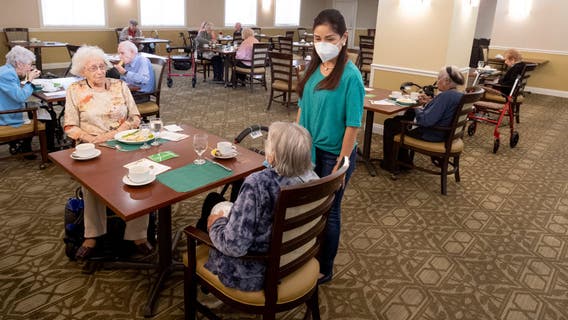 Nursing homes battered by COVID-19 begin easing rules on visitors