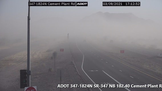 Blowing dust reducing visibility along highway south of Phoenix