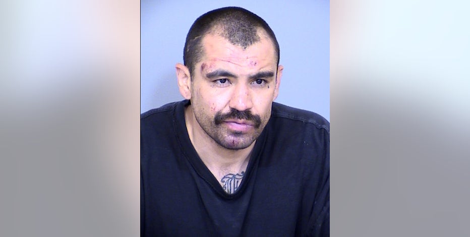 Phoenix man accused of stabbing gas station clerk then spitting in Florida  cop's face