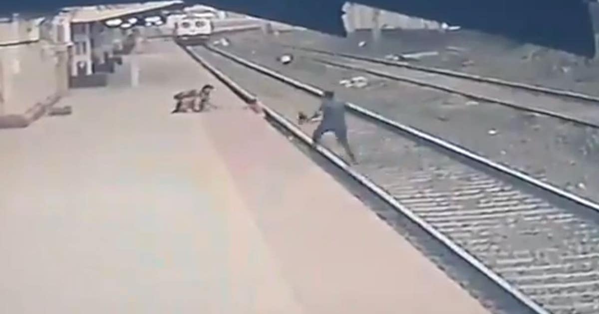 Railway employee in India rescues child who fell on tracks from ...