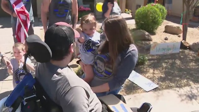 Phoenix officer battling rare spinal cord tumor returns home to warm welcome
