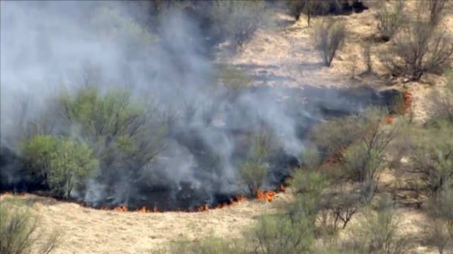 Crews battling large brush fire west of Phoenix