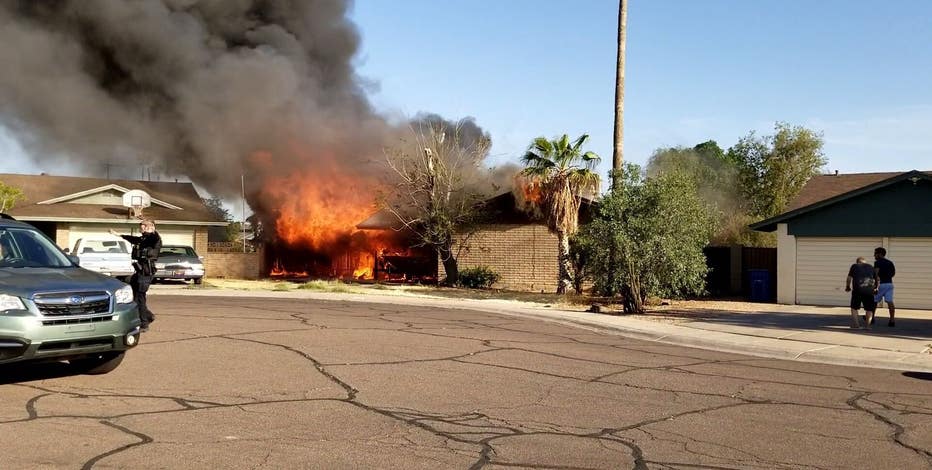 Neighbor and his friends rescue man, his dog from burning Tempe home