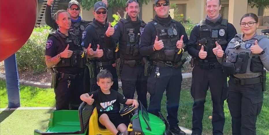 Tempe police officers surprise boy with new toy gator tractor after his old one was stolen