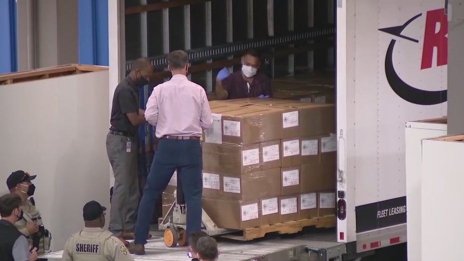 Boxes filled with ballots are delivered to the Arizona State Fairgrounds for the 2020 election audit
