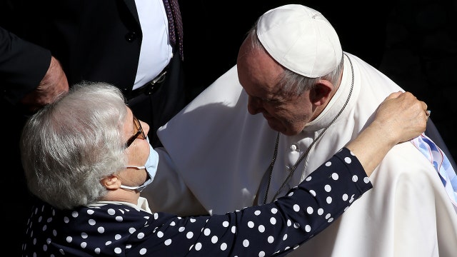 Pope Francis kisses Auschwitz survivor's tattoo