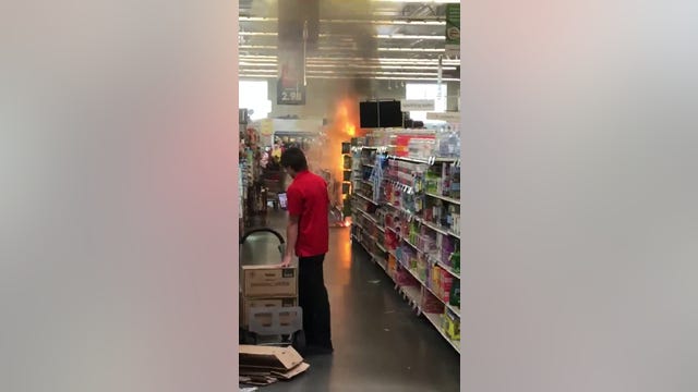 Teens light fireworks display inside Hy-Vee in Eagan, Minnesota
