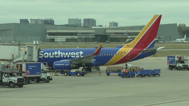 Travelers react as computer woes ground Southwest planes and strand passengers
