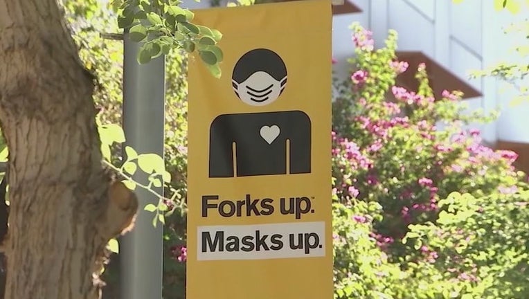 A sign on an ASU campus encouraging people to wear face masks.