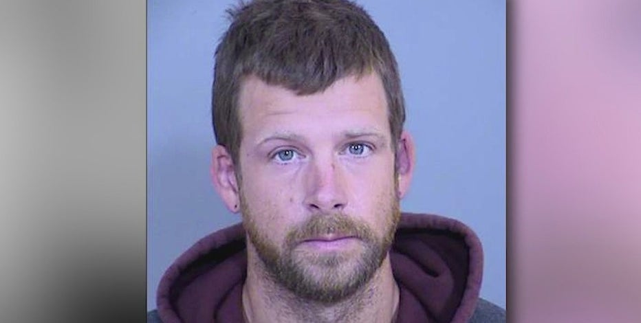 PD: Glendale man called officer racist slurs, spit on second officer's face