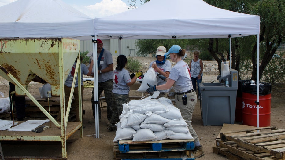 Volunteer organization, Team Rubicon, helps prep homes for possible flooding after wildfires.