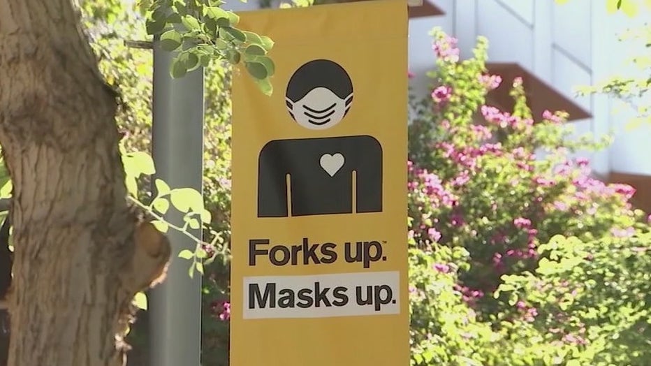 A sign on an ASU campus encouraging people to wear face masks.