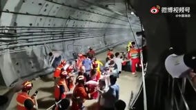 China flooding kills at least 25, traps passengers in subway system