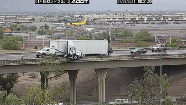 Jackknifed semi dangles over edge of I-17 in Phoenix
