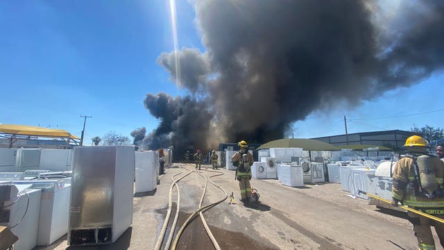 Phoenix Fire crews battle 3-alarm fire at salvage yard