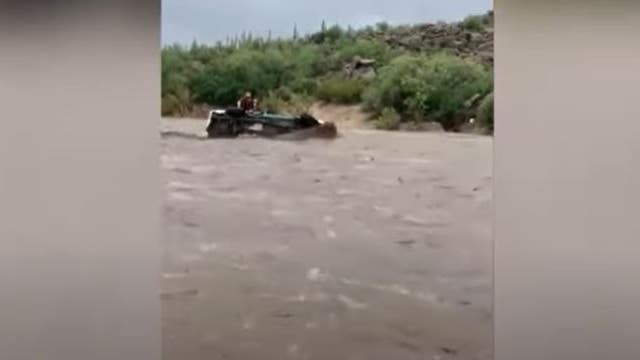 Shocking video: Group escapes floodwaters after car is washed away near Sycamore Creek