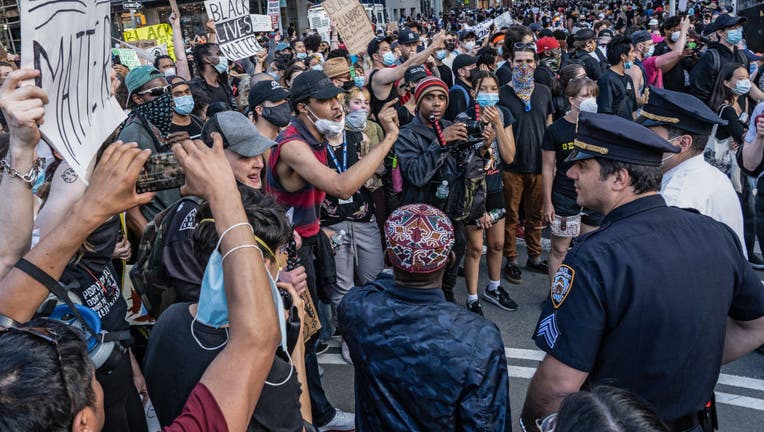Protesters taunt police officers on the fourth straight day