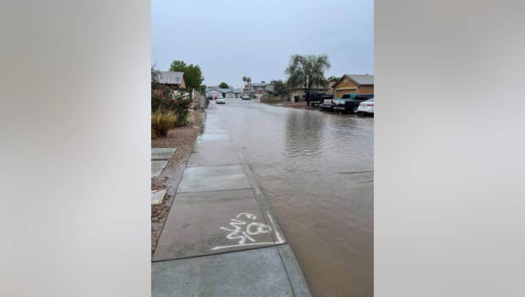 Major streets and neighborhoods in West Phoenix have flooded due to heavy rain Sunday afternoon. 