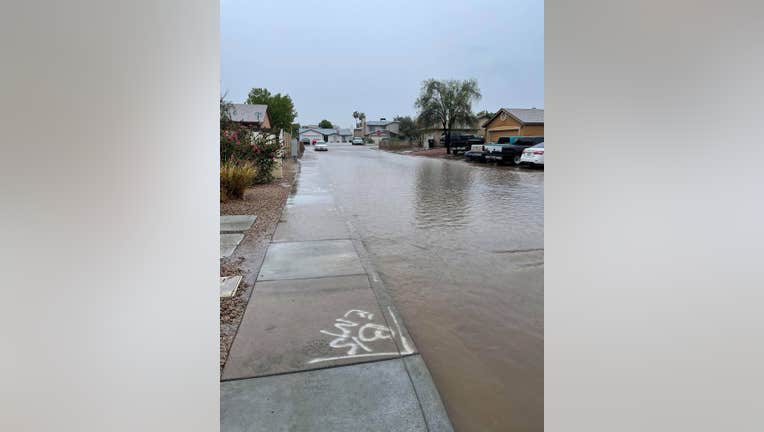 Major streets and neighborhoods in West Phoenix have flooded due to heavy rain Sunday afternoon.