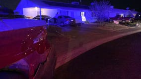 Car runs over a fence, hits 2 cars before crashing into South Phoenix home