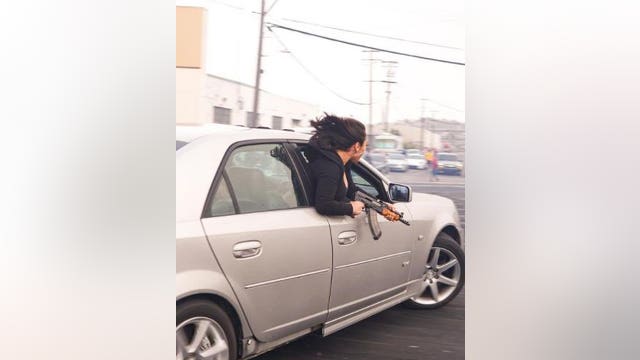 Passenger leaning out of car wields AK-47 at illegal San Francisco event