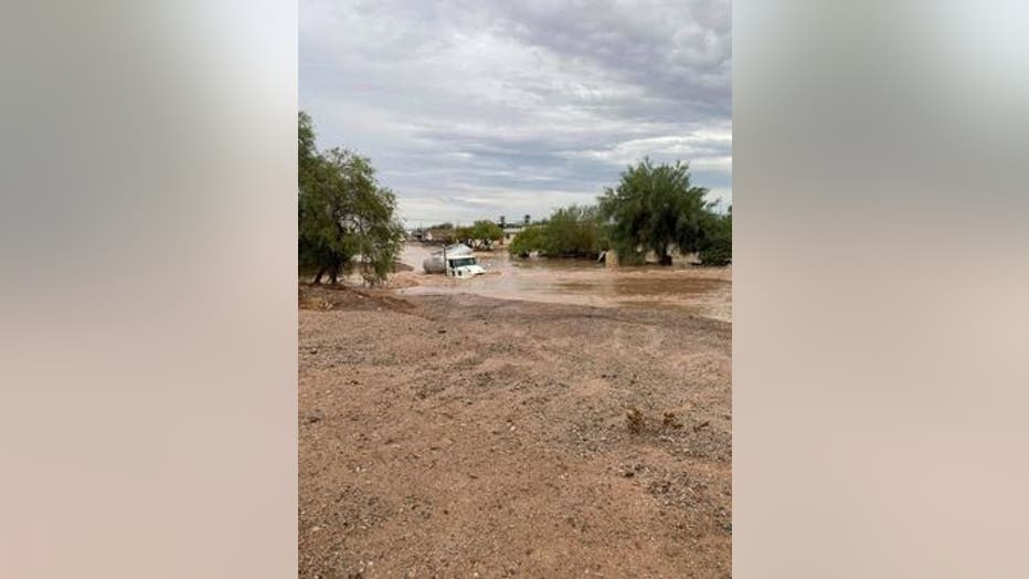 A semi is shown submerged underwater after a night of severe flooding in Gila Bend. 