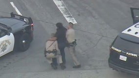 Video: Police chase suspect tries to fight off CHP officers arresting him