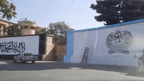 Taliban paints its flag on outside wall of what was US embassy in Kabul