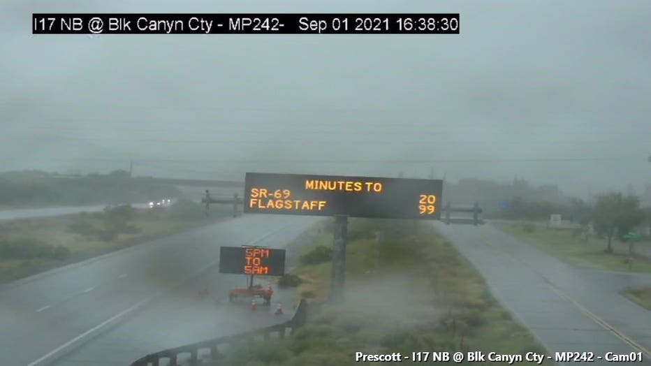 Rain falling over Black Canyon City. Photo by ADOT