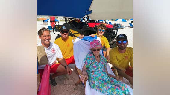 Alabama lifeguards help 95-year-old down to beach every day during her stay