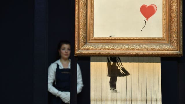 Banksy street art that self shredded at auction sells for $25.4 million