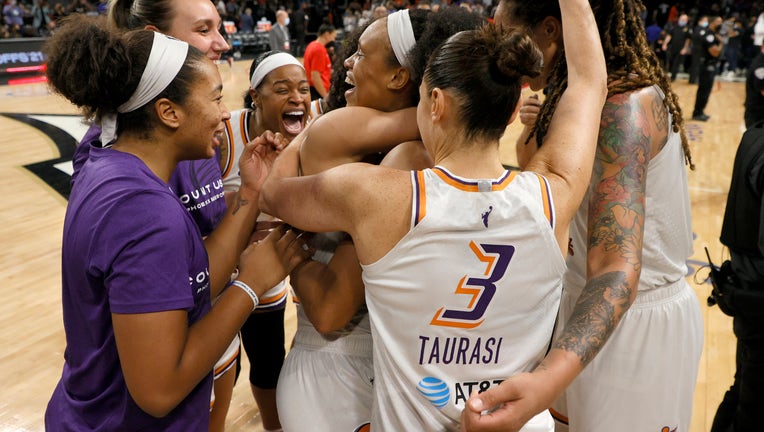 The Phoenix Mercury celebrate after defeating the Las Vegas Aces 87-84 in Game Five of the 2021 WNBA Playoffs semifinals