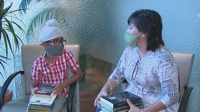 Phoenix boy creates the Loving Library to share his love of books with the community