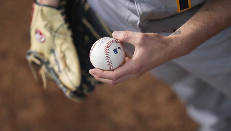 A detailed view of a baseball with an MLB logo on it