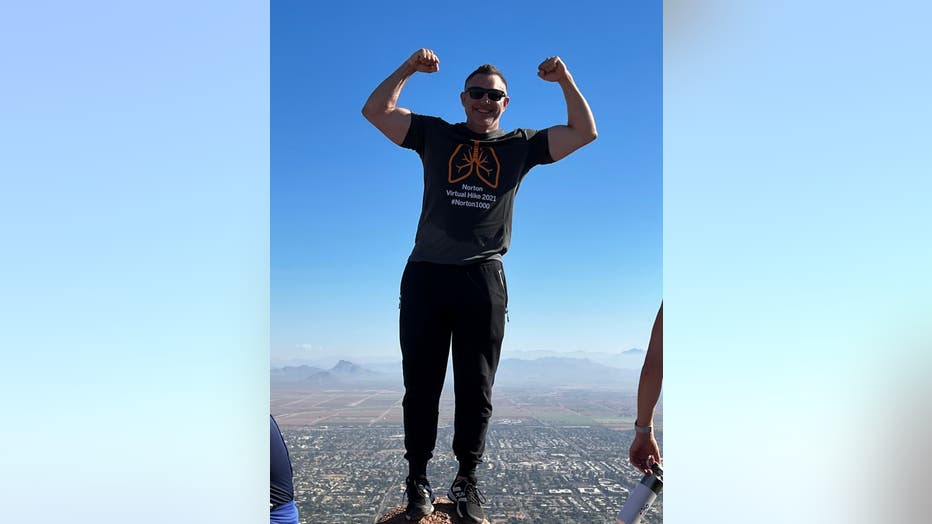 Dr. Karl Viddal at the summit of Camelback Mountain.