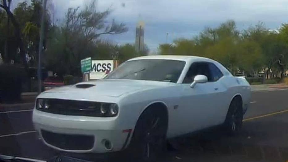 On Dec. 17, police released information about a possible suspect vehicle being a 2015 white Dodge Challenger with Arizona license plate "AMA 3BC" that was involved in an apparent road rage shooting that killed a woman.