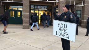 'You are loved': Officer stands outside of Magruder High School on first day back since shooting
