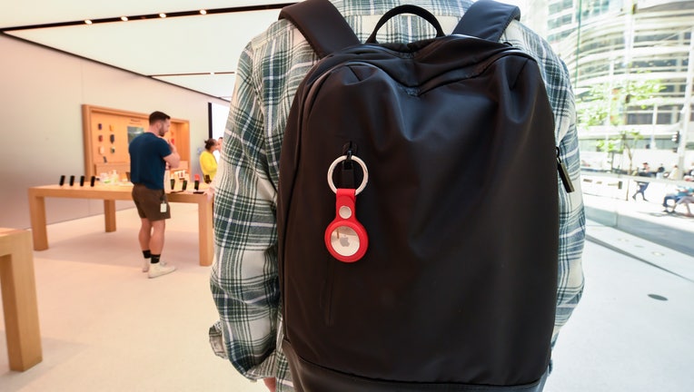 A key ring containing an AirTag attached to a backpack (Photo by James D. Morgan/Getty Images)